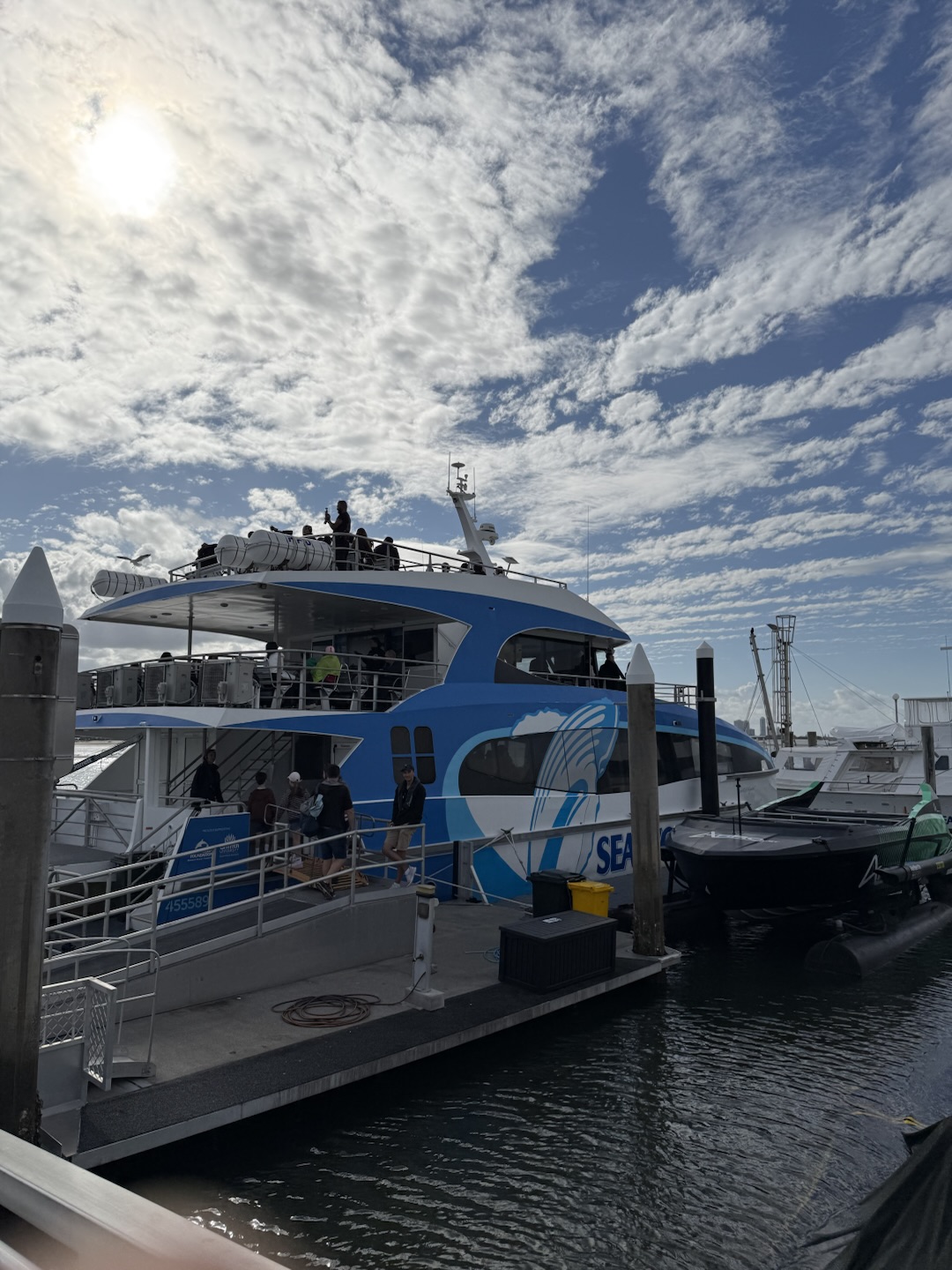 Passengers boarding the Sea World Cruises boat via the gangway